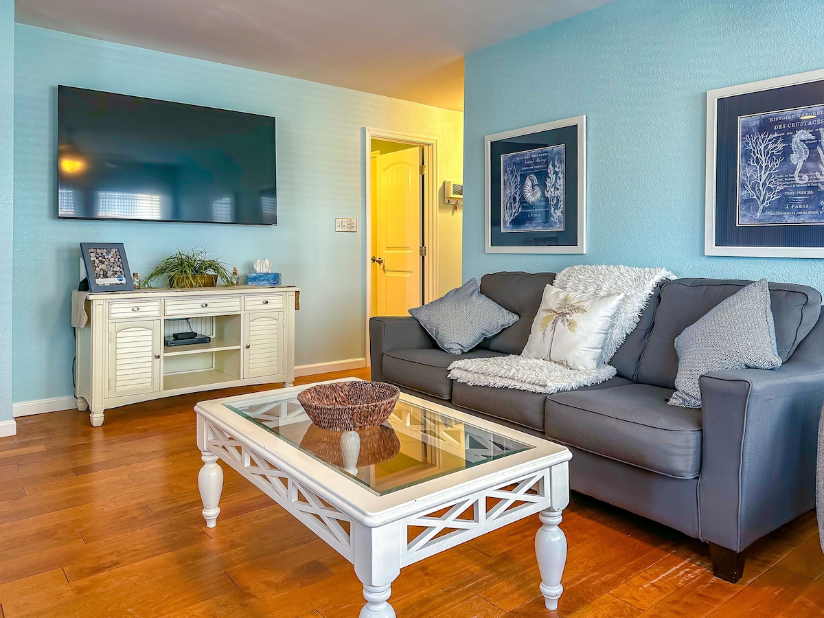 Living room with sofa and wall-mounted TV