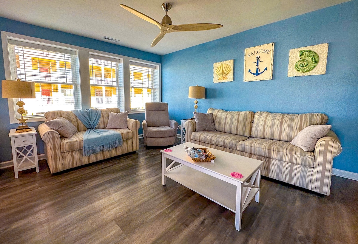 Living room with striped sofas